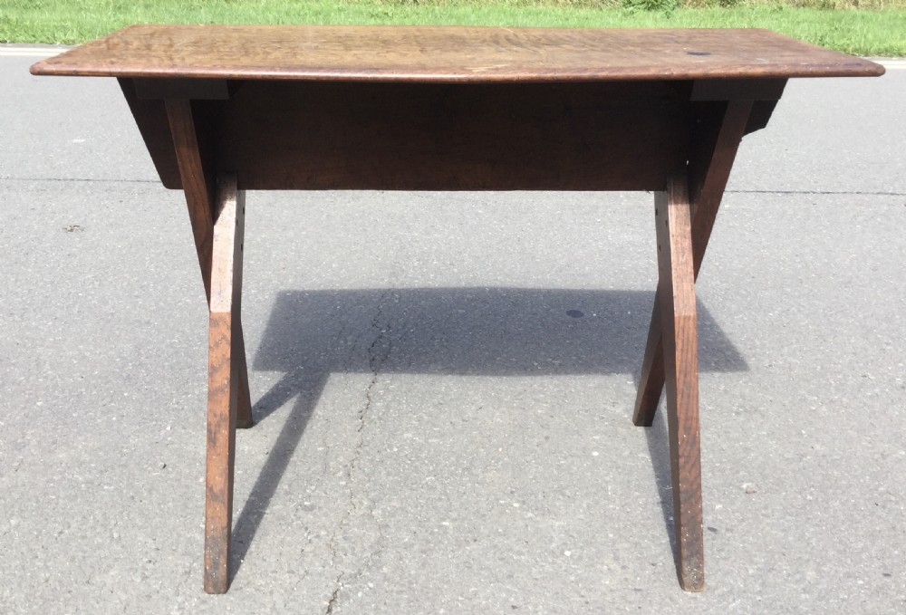An Arts and Crafts style rectangular elm table featuring scissor-style cross base legs and visible natural timber grain. View VII