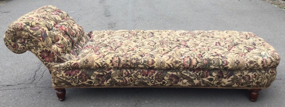 A Victorian upholstered daybed featuring deep-buttoned floral tapestry fabric with a scrolled end rest and turned wooden legs. View XIII