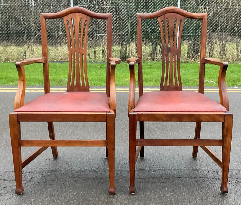 A pair of Georgian style mahogany carver armchairs with pierced splat backs and red leather padded seats. View III
