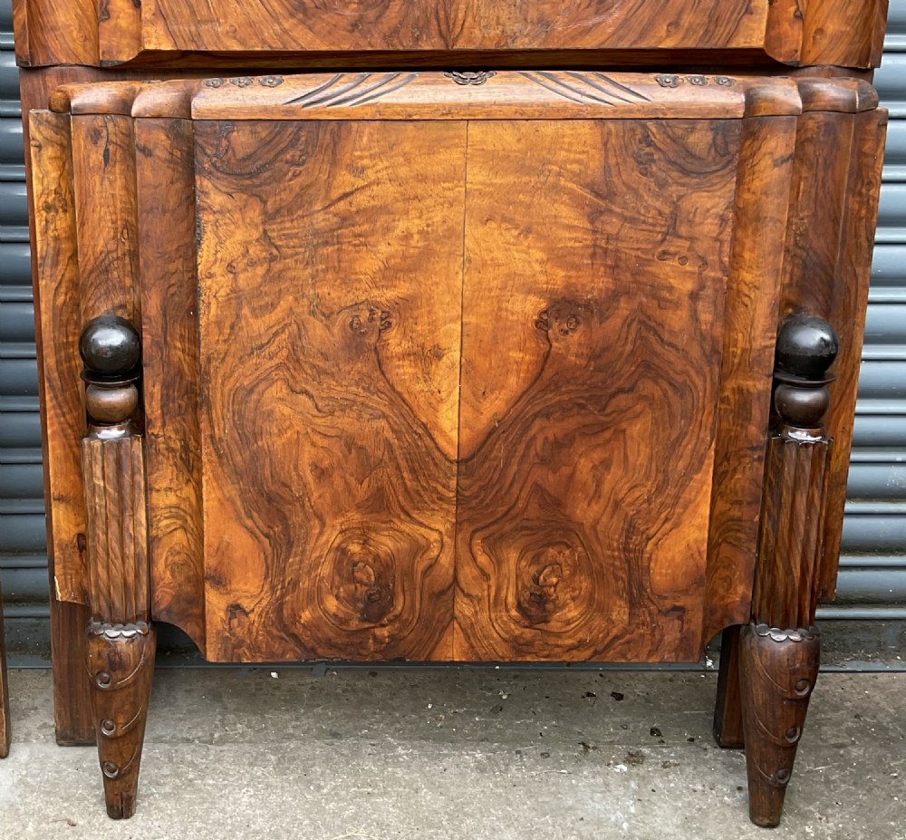 A pair of Art Deco burr walnut single bed frames featuring carved fan crests and geometric posts. View IV