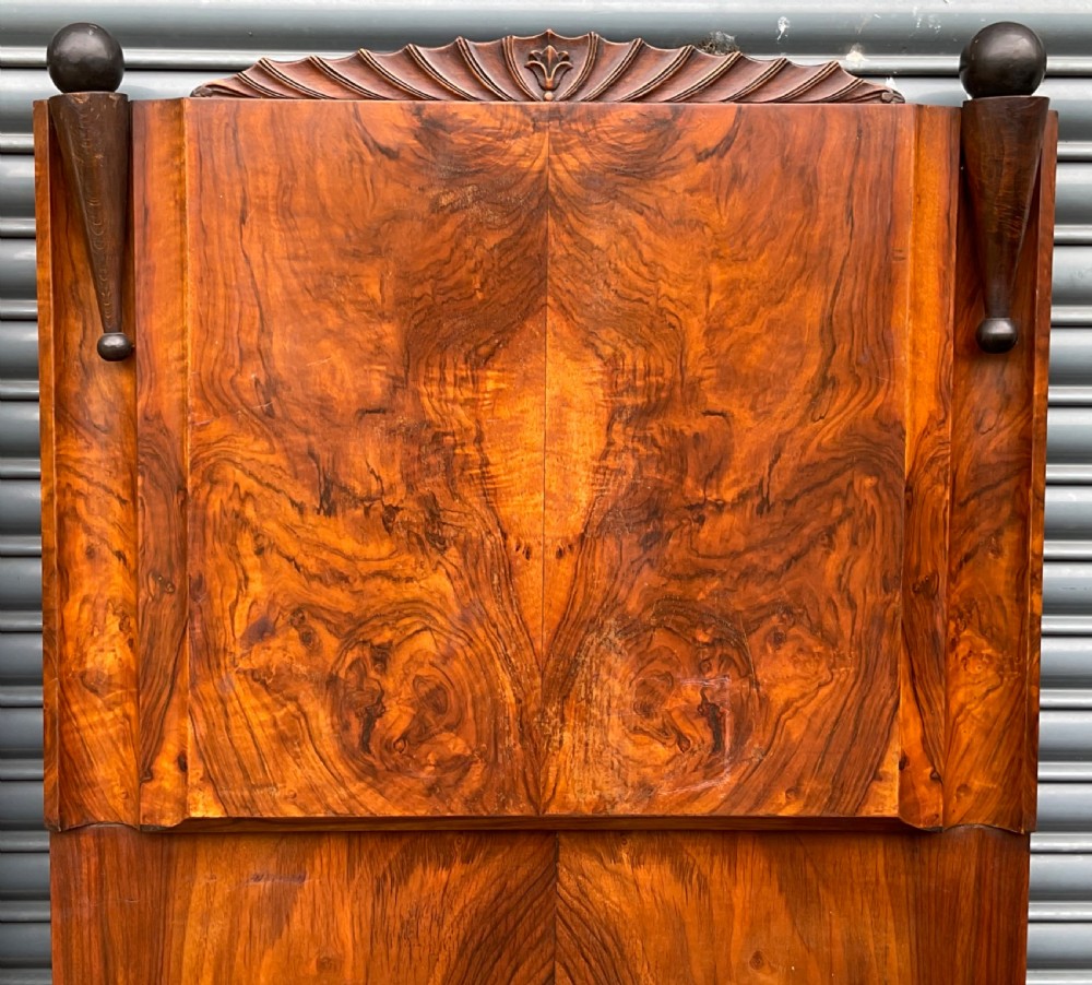 A pair of Art Deco burr walnut single bed frames featuring carved fan crests and geometric posts. View VIII