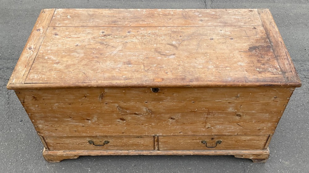 A large Georgian pine mule chest featuring a lift-top storage section above two lower drawers with brass drop handles and bracket feet. View VIII