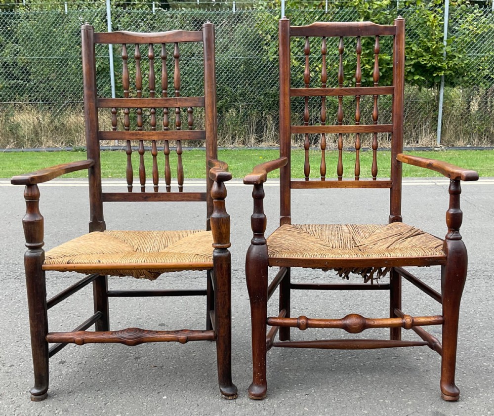 Pair of antique warm brown elm armchairs featuring tiered turned spindle backs and woven rush seats. View IV
