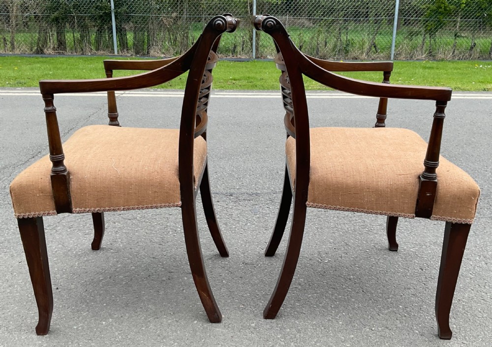 Set of six dark mahogany Georgian dining chairs featuring reeded frames, carved bar backs, and beige fabric seats. View XI