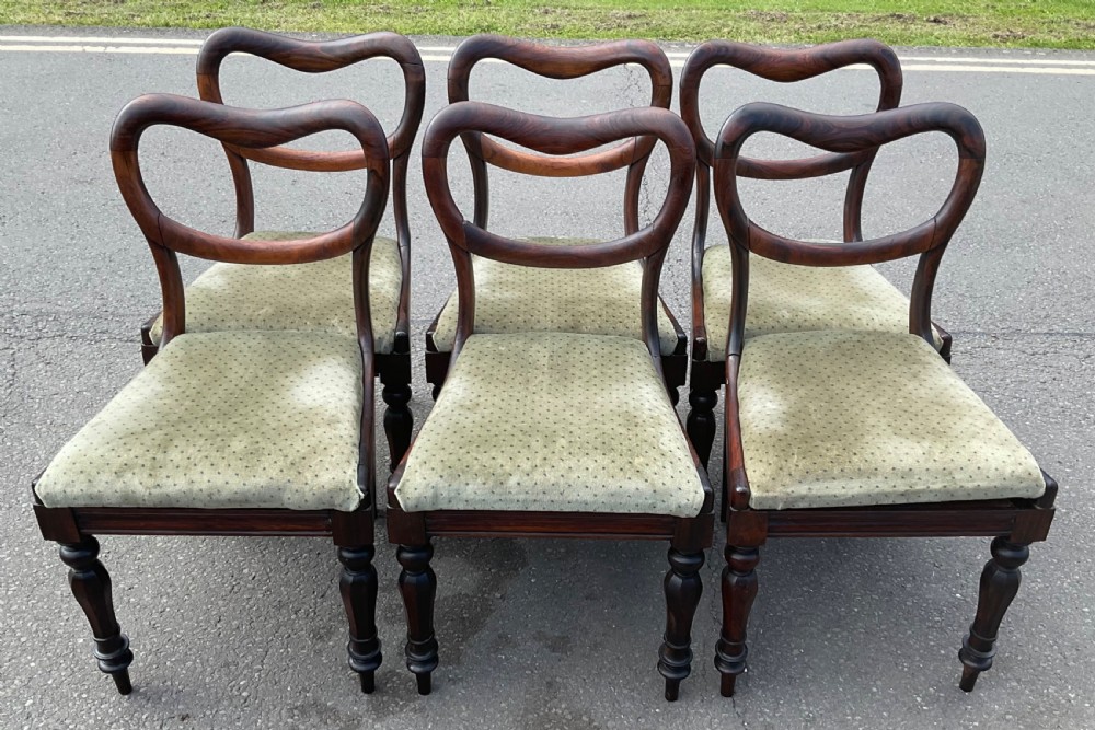 A set of six Victorian rosewood balloon back dining chairs with green velvet upholstered seats and turned front legs. View IV