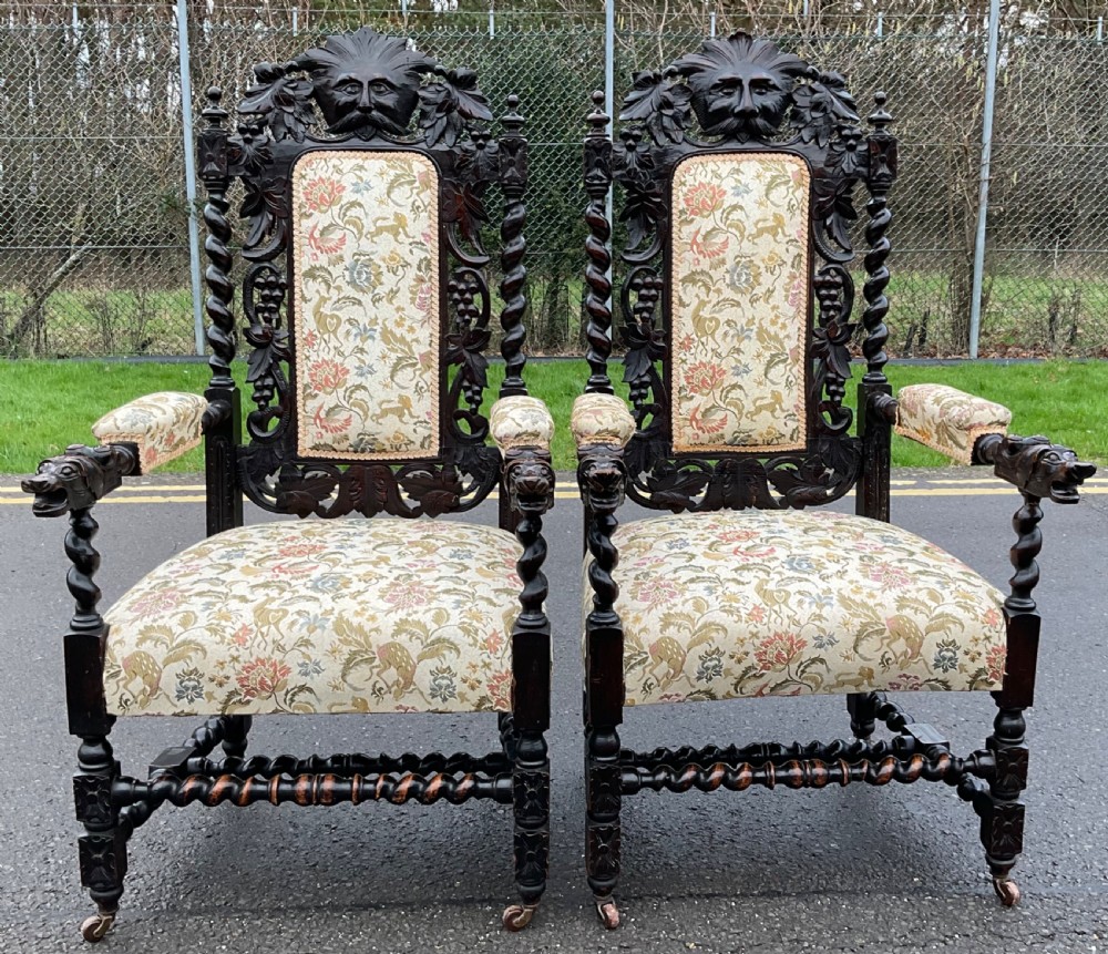 Pair Victorian Heavily Carved Oak Armchairs