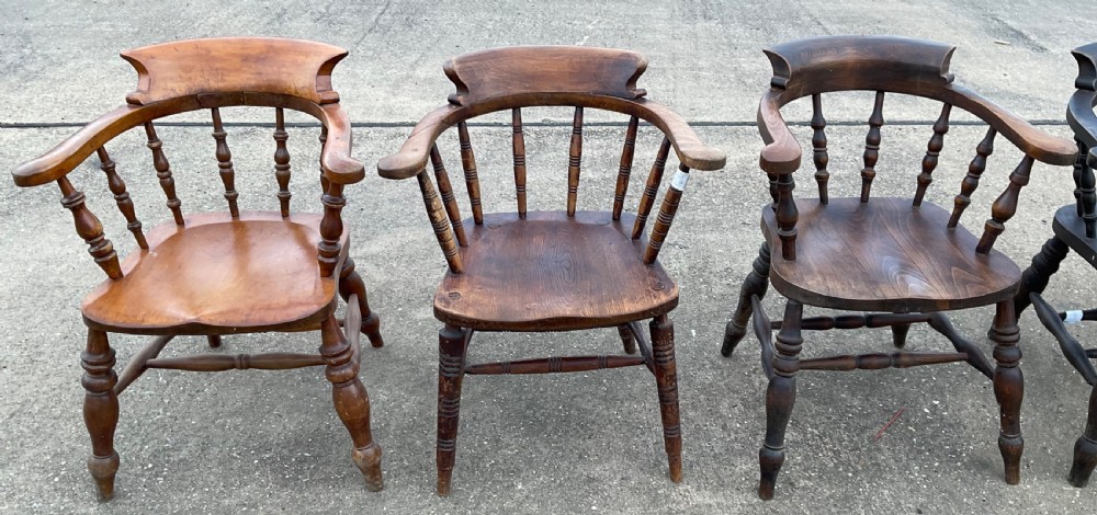 A set of six Victorian smokers bow armchairs with turned spindles, contoured saddle seats, and H-stretchers. View IV