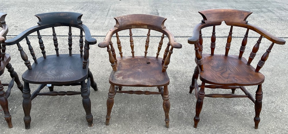 A set of six Victorian smokers bow armchairs with turned spindles, contoured saddle seats, and H-stretchers. View VII