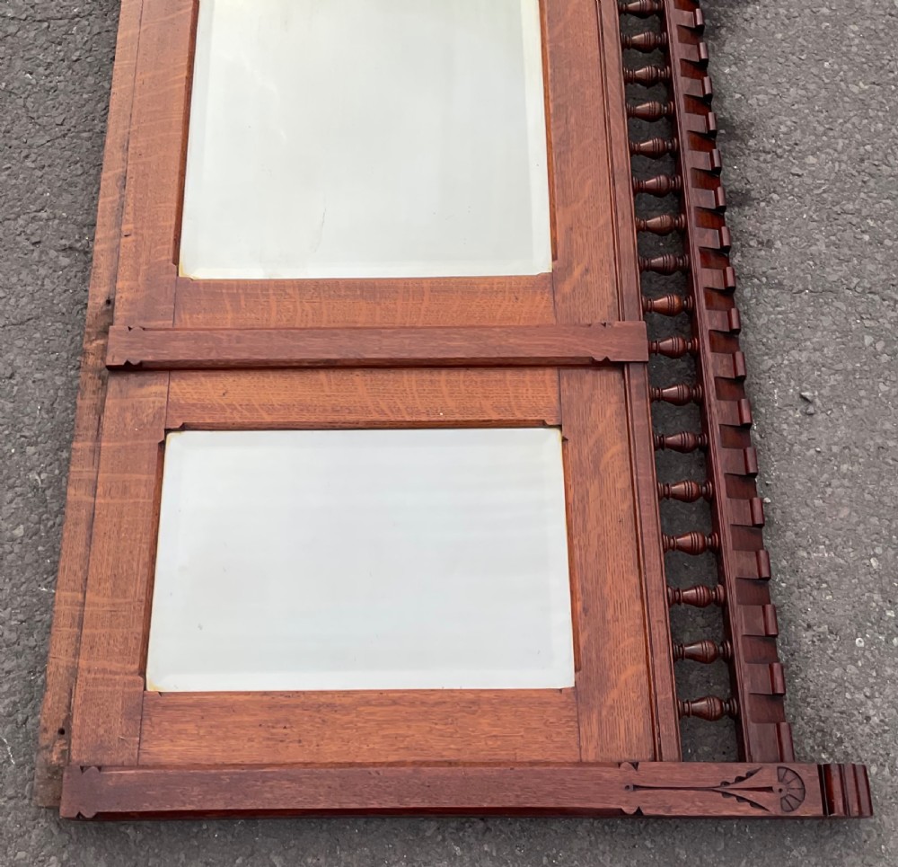 A large Victorian Gothic quarter-sawn oak overmantel mirror featuring three mirror panels and a decorative spindle gallery along the top rail. View III