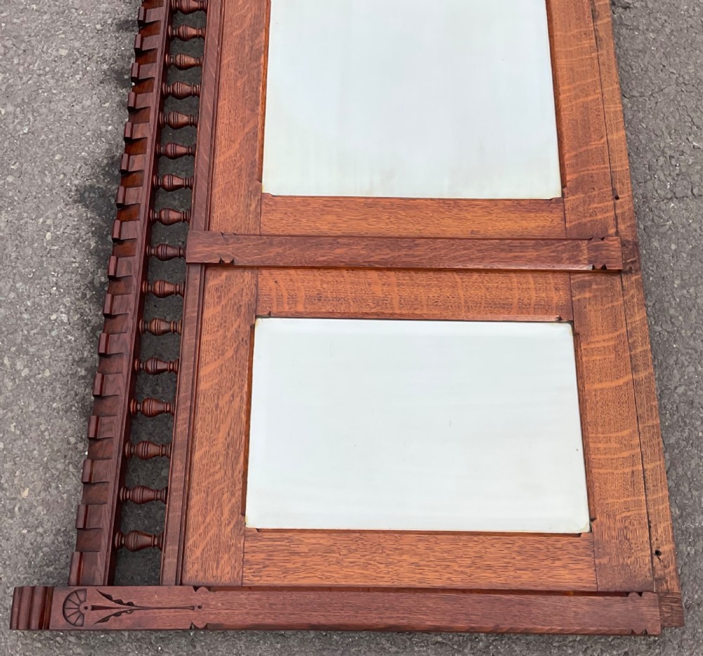 A large Victorian Gothic quarter-sawn oak overmantel mirror featuring three mirror panels and a decorative spindle gallery along the top rail. View IV