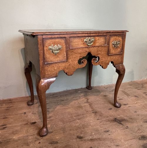 Georgian Oak Lowboy with Bird's Head Frieze