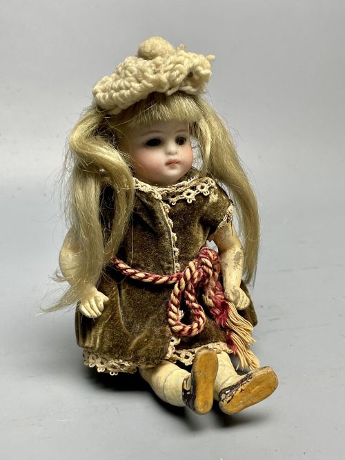 Small German Bisque Head Doll in Original Clothing