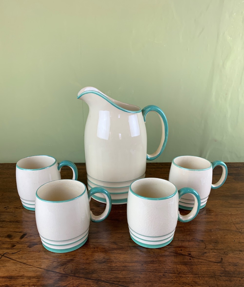 Art Deco Grays Pottery jug and four matching mugs