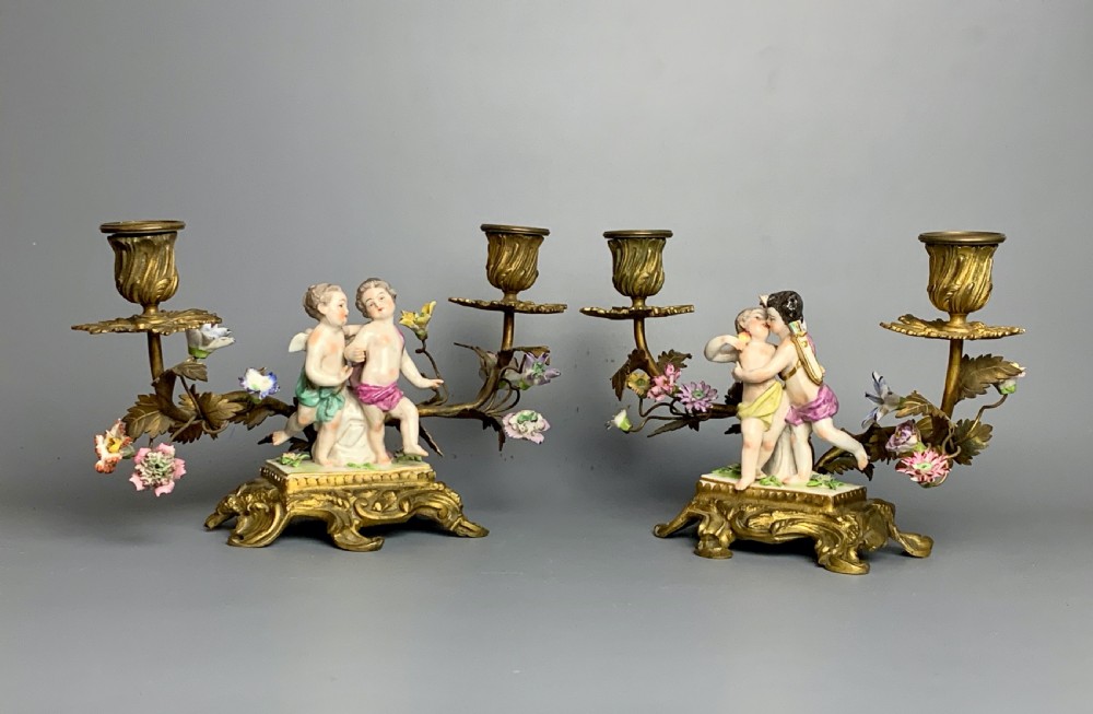 Pair of Continental porcelain ormolu mounted candelabra with cherubs View II