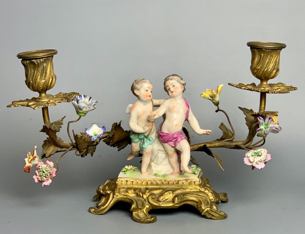 Pair of Continental porcelain ormolu mounted candelabra with cherubs View IV