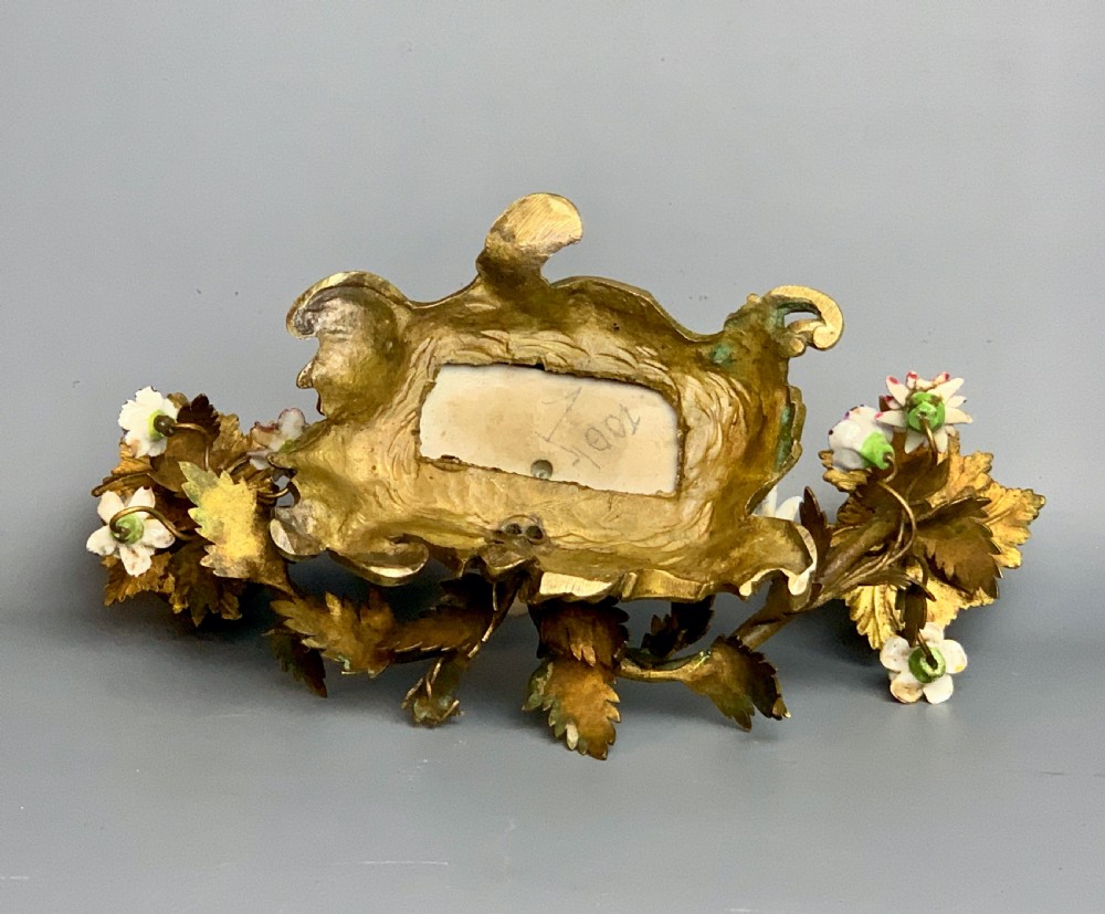 Pair of Continental porcelain ormolu mounted candelabra with cherubs View V