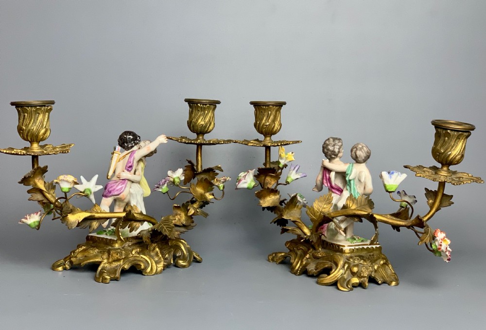 Pair of Continental porcelain ormolu mounted candelabra with cherubs View VI