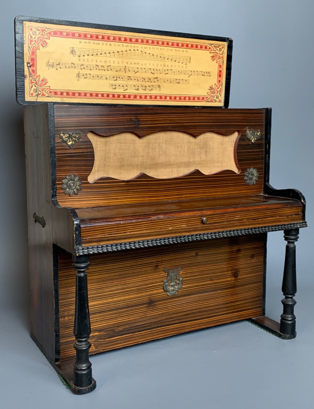 Antique German child's toy piano with faux bois case, circa 1910 View IV