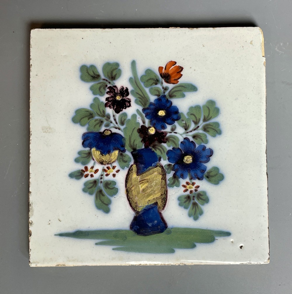 Bristol Delft polychrome tile with a vase of flowers 