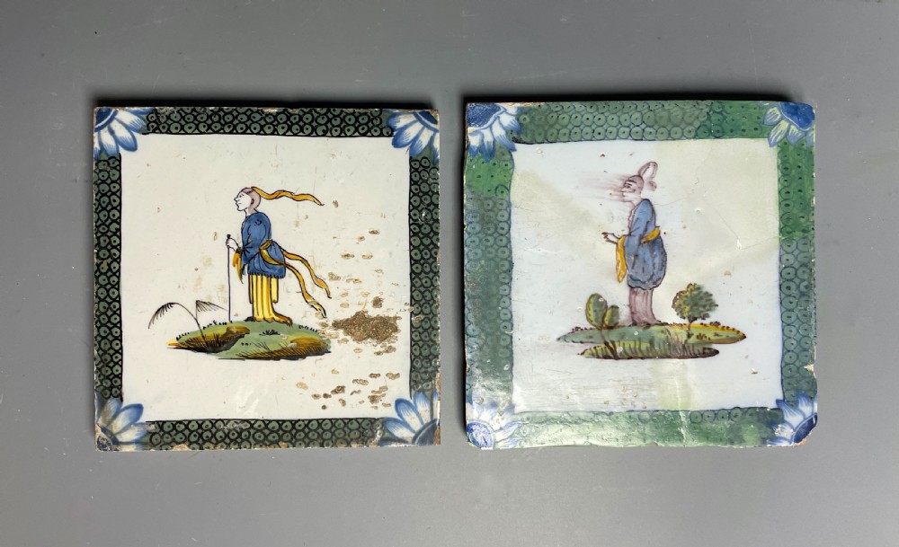 Two Bristol Delft polychrome chinoiserie tiles with fish roe borders