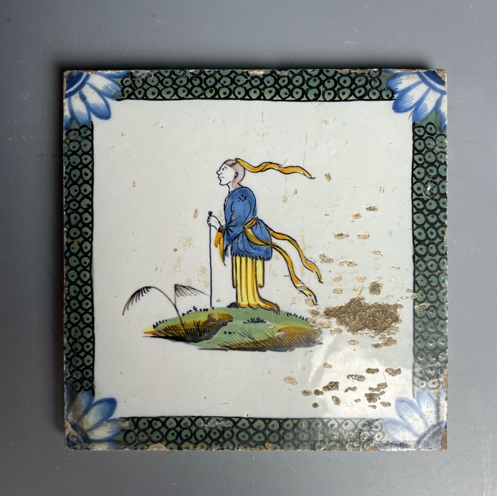 Two Bristol Delft polychrome chinoiserie tiles with fish roe borders View II