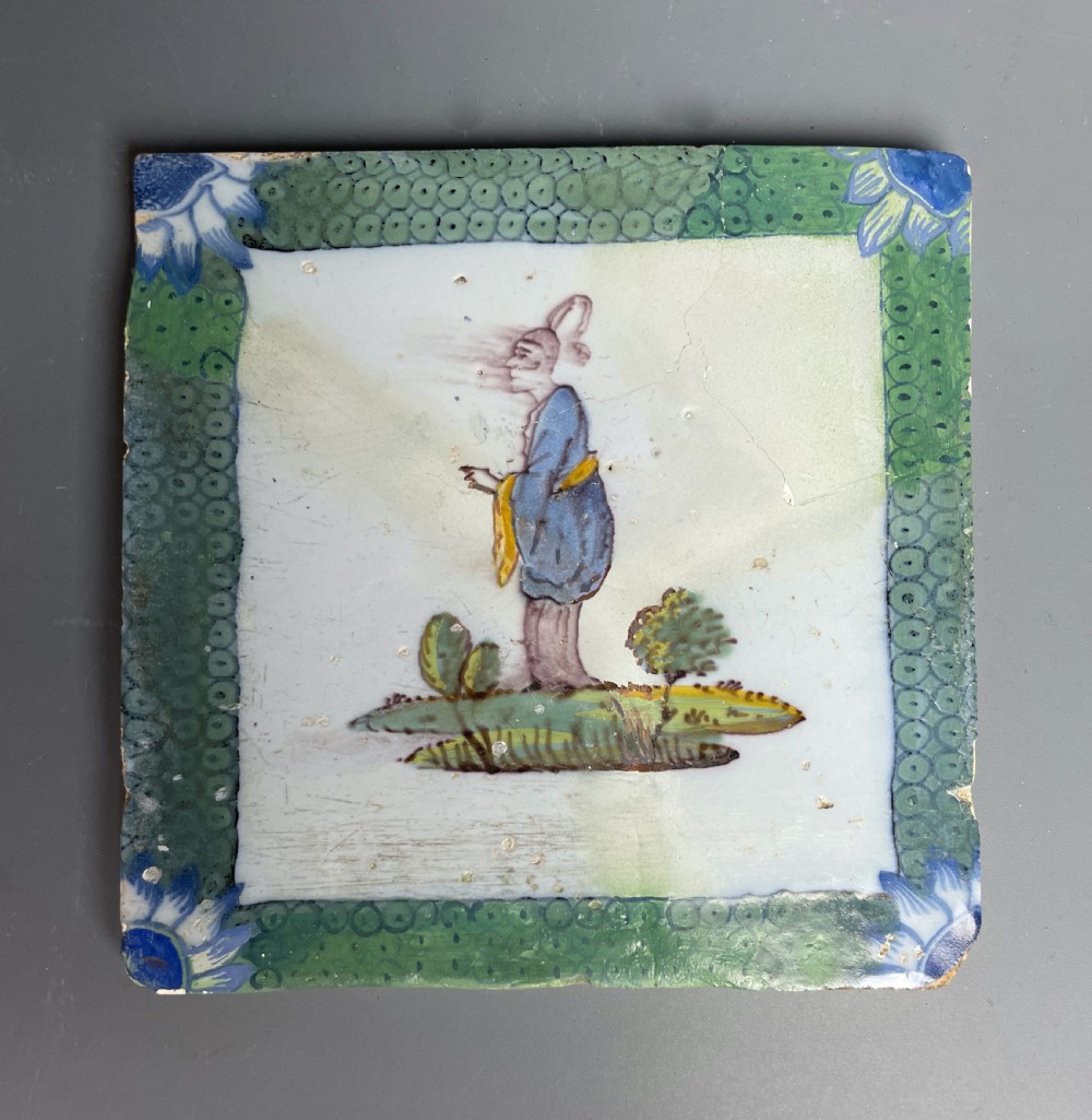 Two Bristol Delft polychrome chinoiserie tiles with fish roe borders View III