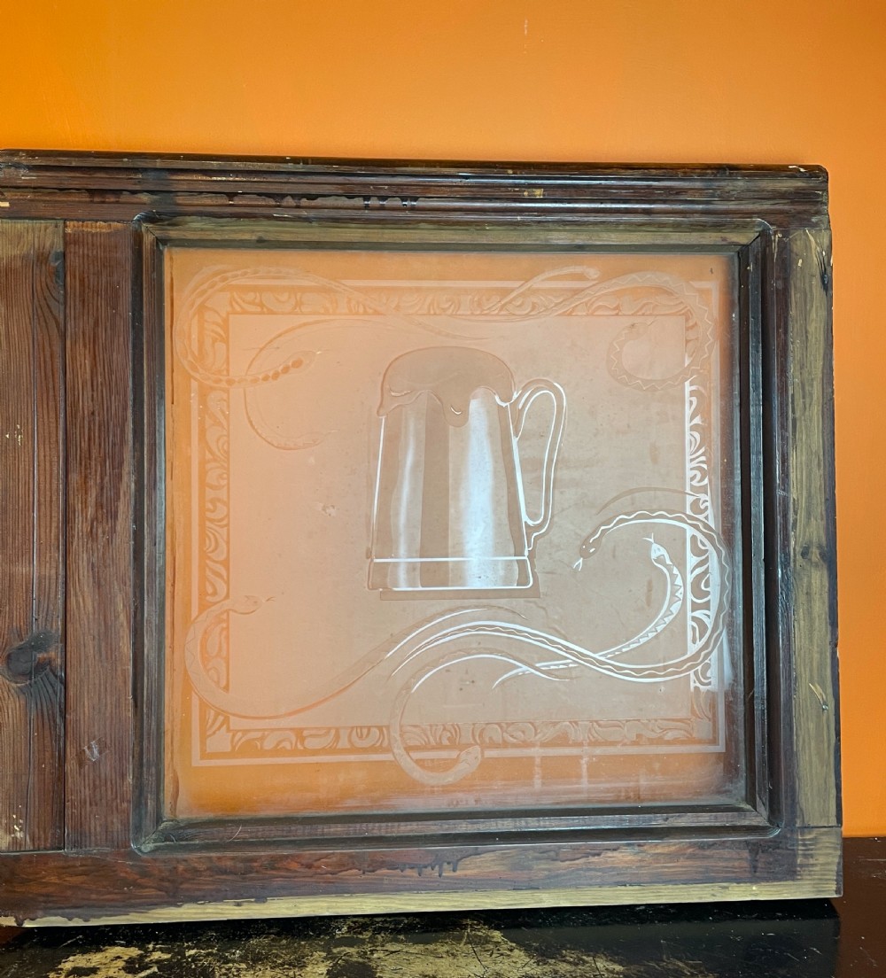 Pair of Victorian acid etched pub windows decorated with snakes View II