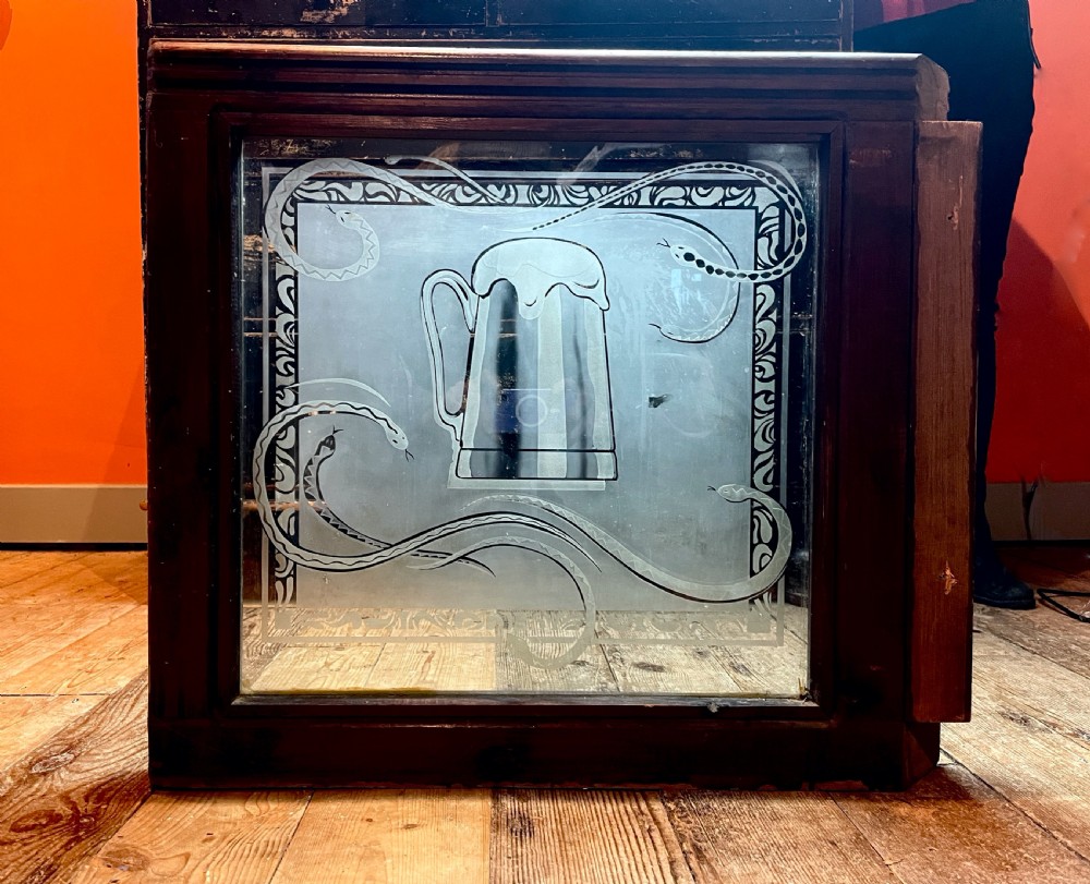 Pair of Victorian acid etched pub windows decorated with snakes View V