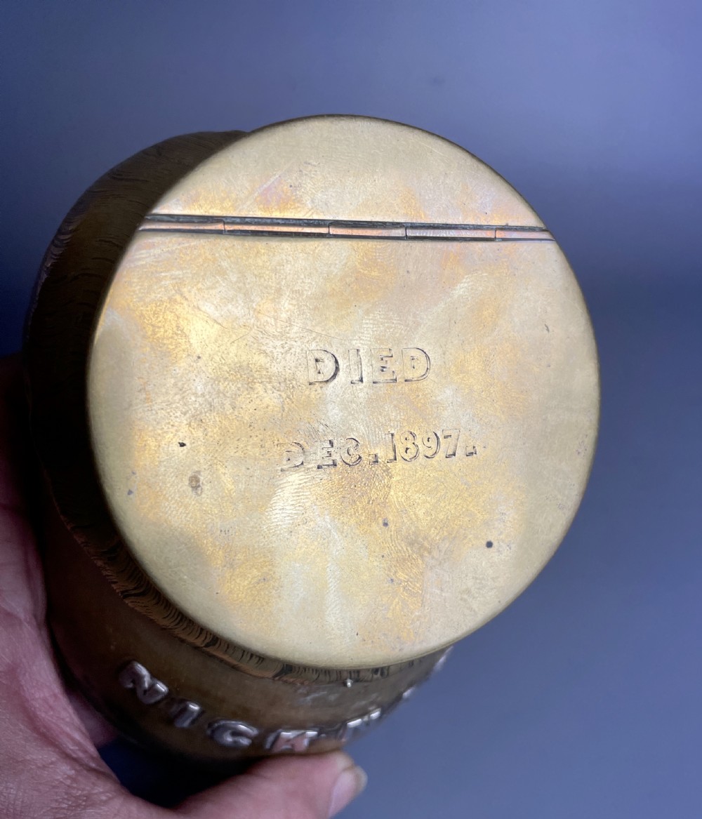 A Victorian horse hoof inkwell featuring brass mounts, a hinged brass lid, and silver lettering reading NICK-NACK. View IV