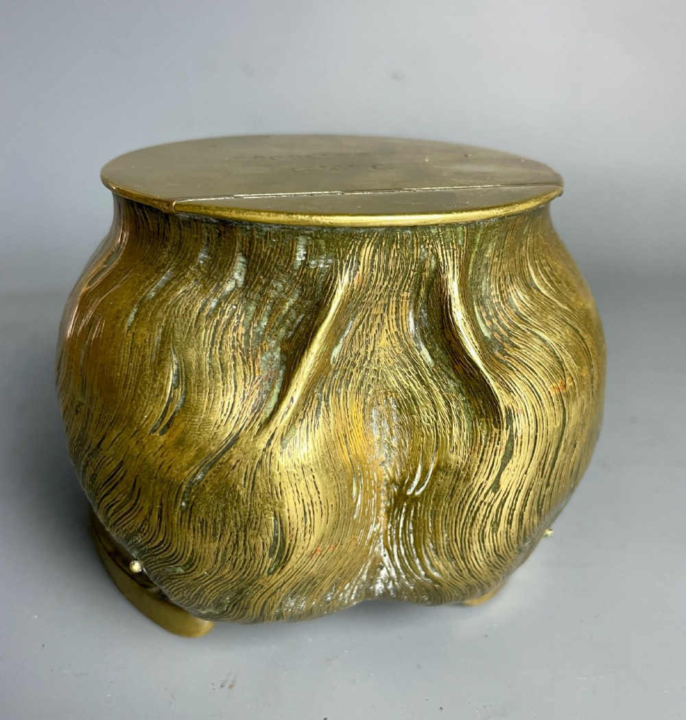 A Victorian horse hoof inkwell featuring brass mounts, a hinged brass lid, and silver lettering reading NICK-NACK. View V