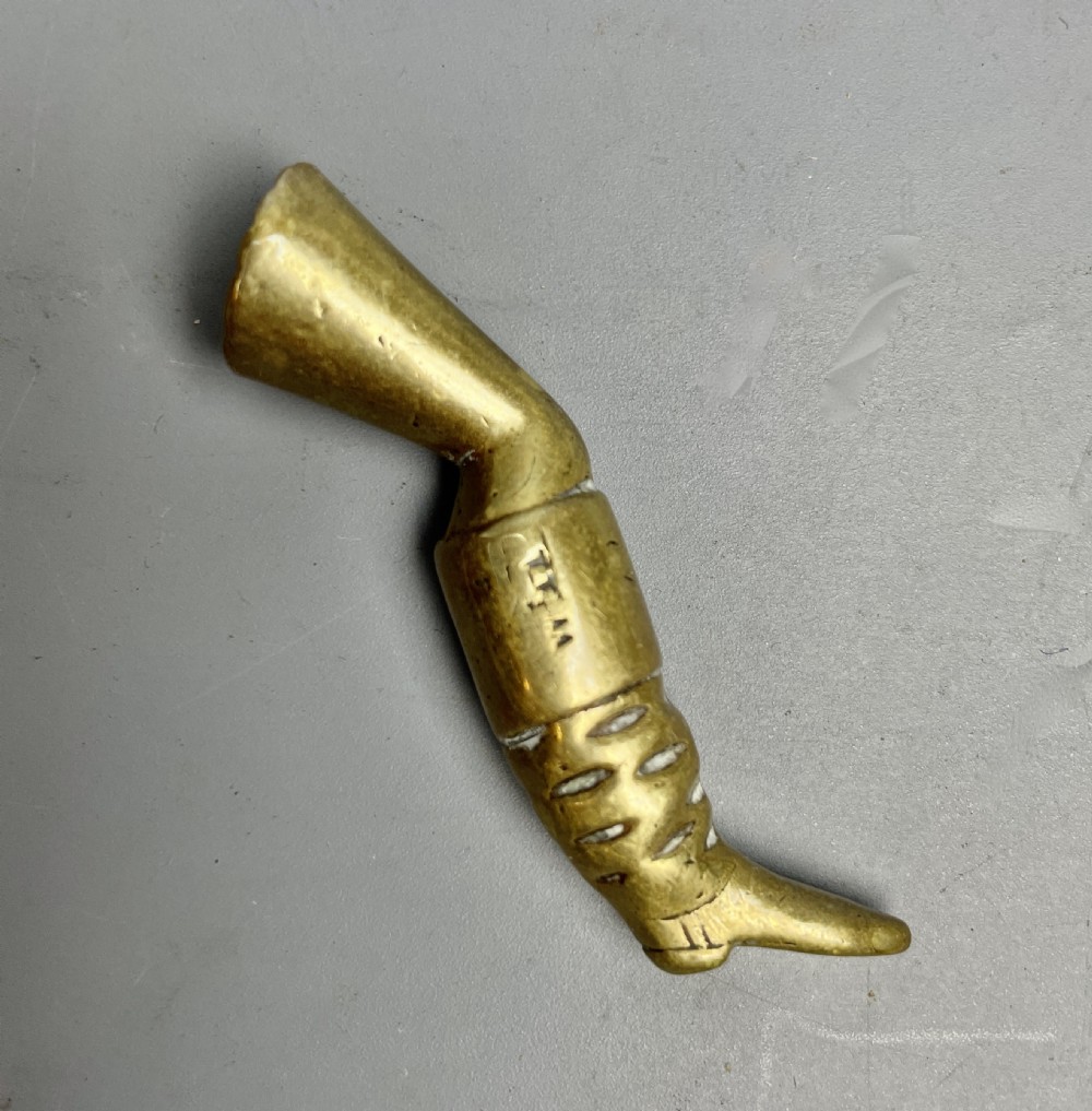 Georgian brass pipe tamper in the form of a booted leg View II