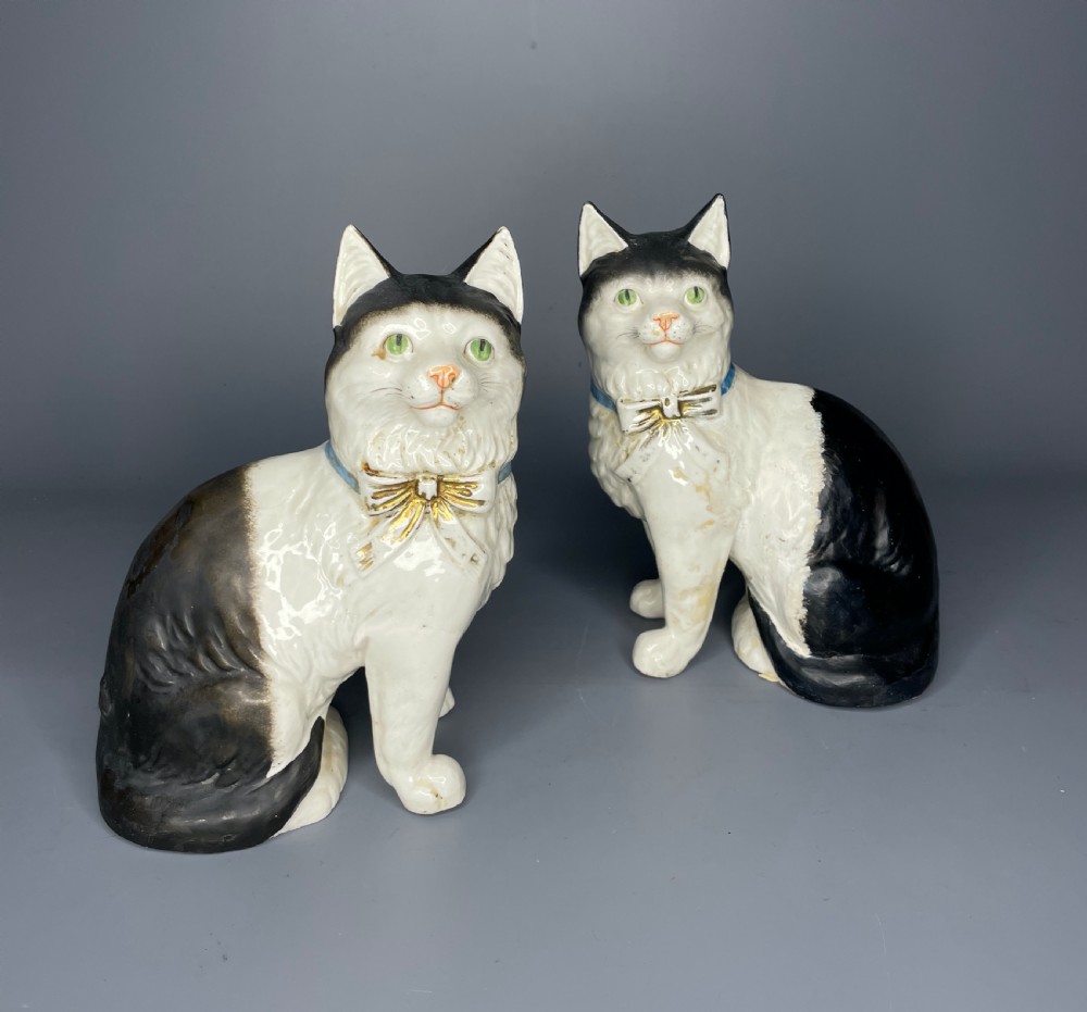 Pair of Continental pottery black & white seated cats View II