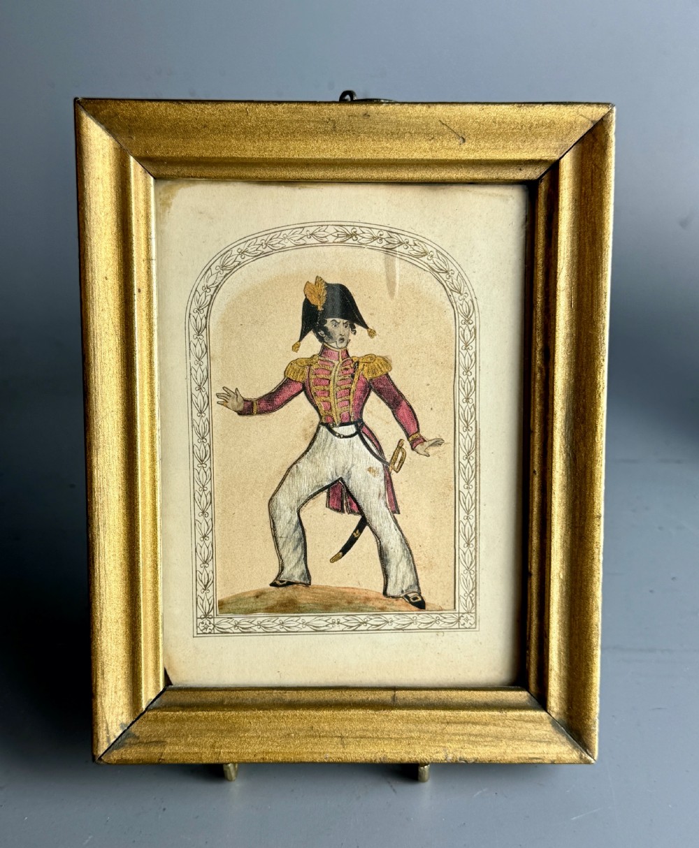 A pair of framed mid-nineteenth-century theatrical silkwork pictures depicting figures in period costume within moulded gilt wooden frames. View IV