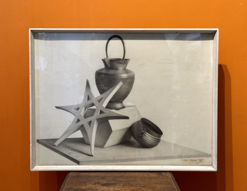 A framed monochrome pencil drawing depicting a Victorian still life study of geometric shapes, a vessel, and a star form.