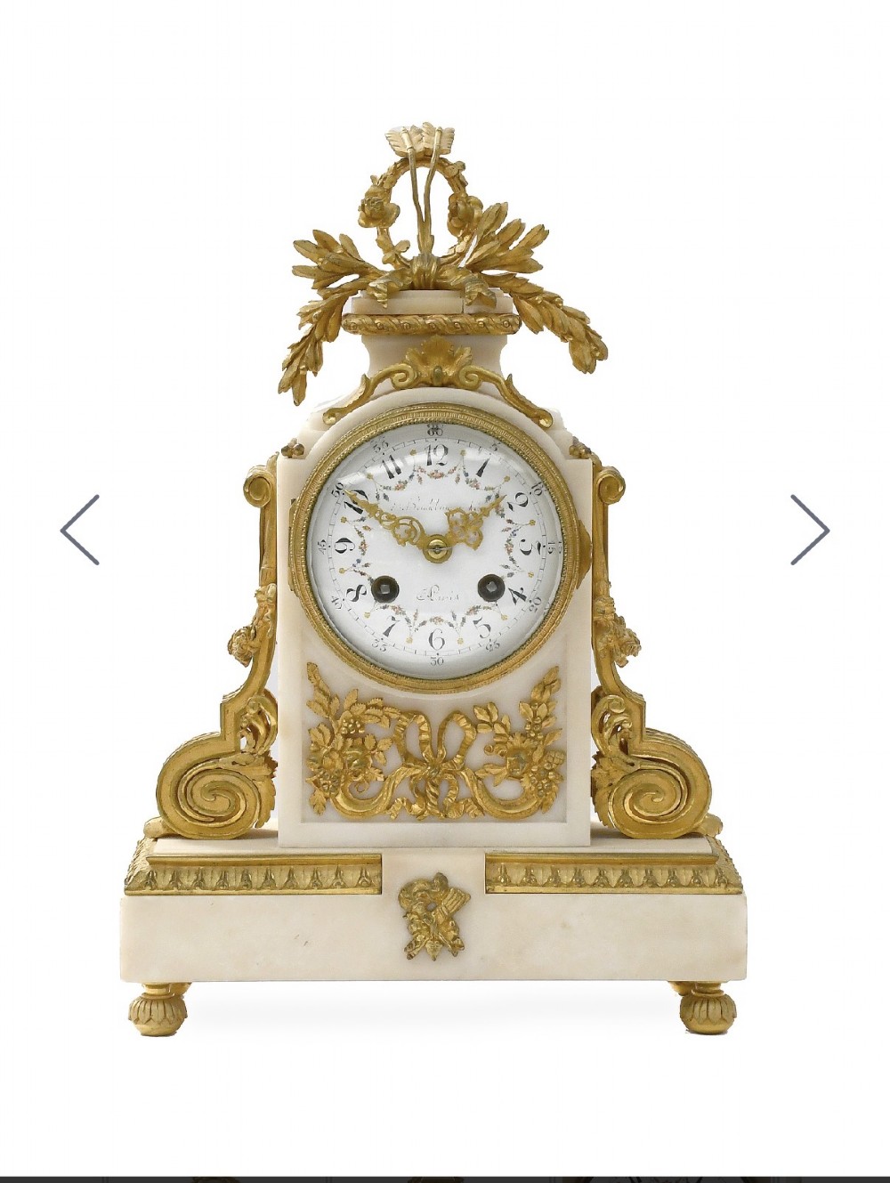 A late 19th-century French gilt bronze and white marble mantel clock garniture set flanked by two matching two-light candelabra. View III