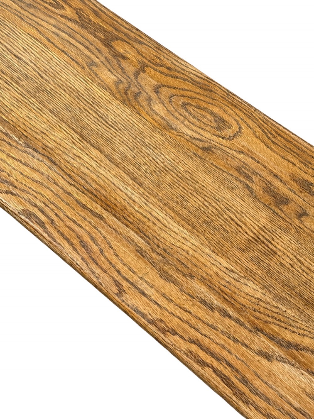 An exceptionally long rustic antique oak bench featuring a smooth rectangular seat, turned legs, and low connecting stretchers. View V