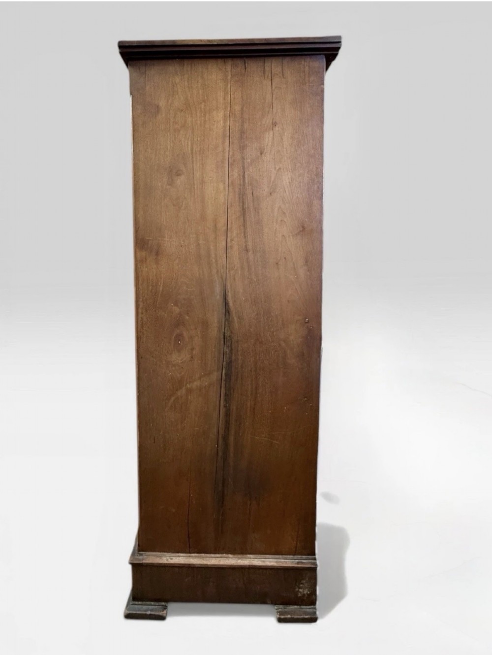 A tall Victorian mahogany chest of drawers featuring two short drawers above four long drawers with brass drop handles and a plinth base. View IV