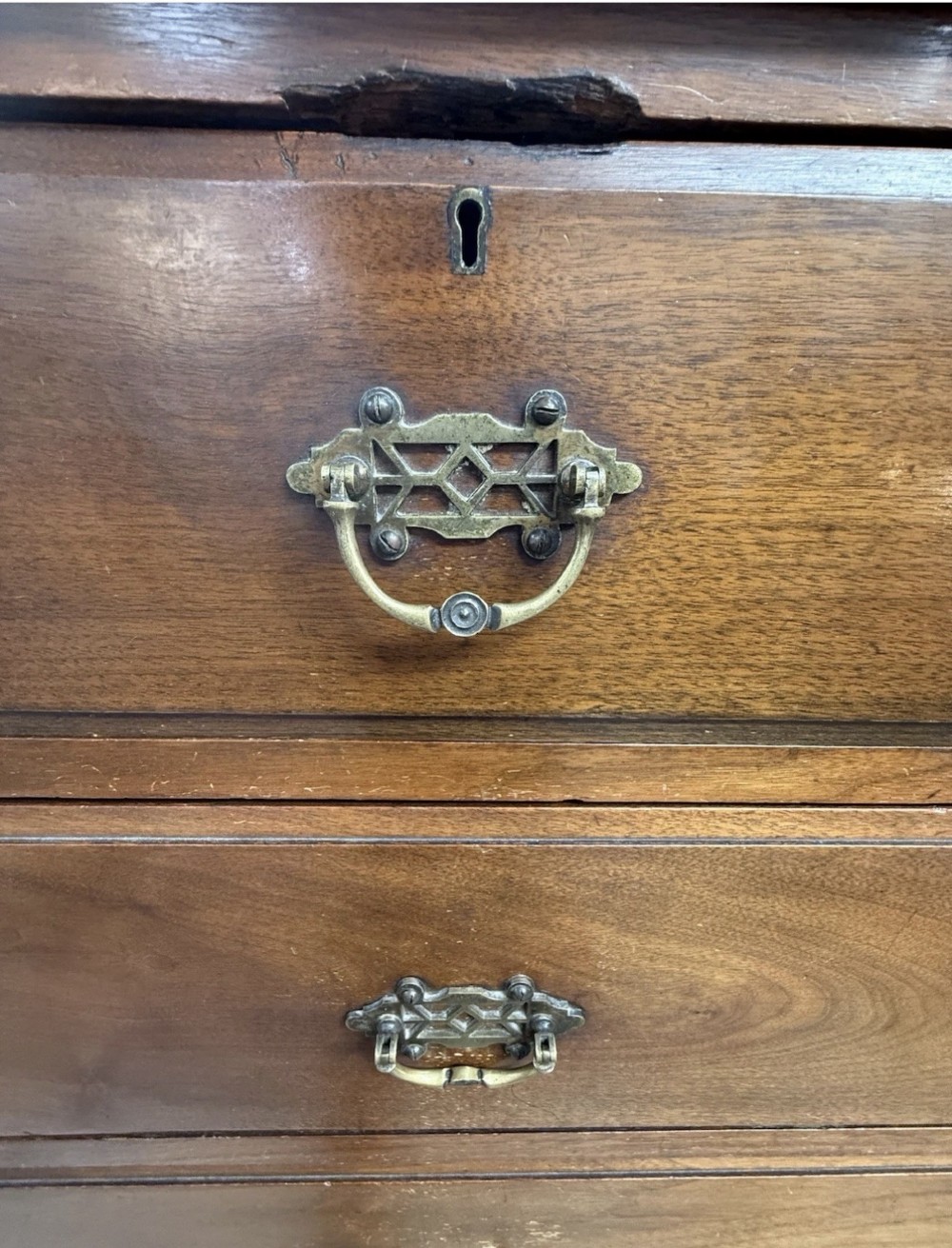 A tall Victorian mahogany chest of drawers featuring two short drawers above four long drawers with brass drop handles and a plinth base. View VIII