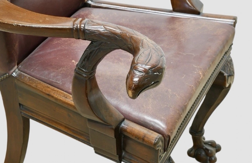Victorian mahogany library armchair upholstered in button-backed brown leather with carved cabriole legs and claw and ball feet. View III
