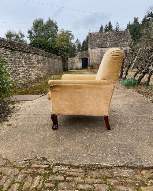 A COUNTRY HOUSE ARMCHAIR WITH BALL AND CLAW FEET - ADDITIONAL PHOTO 1