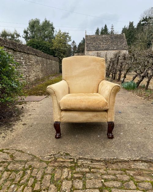 A COUNTRY HOUSE ARMCHAIR WITH BALL AND CLAW FEET - ADDITIONAL PHOTO 2