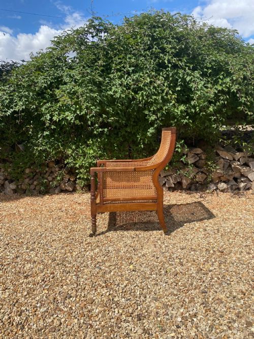 A REGENCY BERGERE ARMCHAIR - ADDITIONAL PHOTO 5