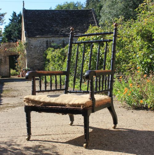 A 19TH CENTURY EBONISED ARMCHAIR - ADDITIONAL PHOTO 2