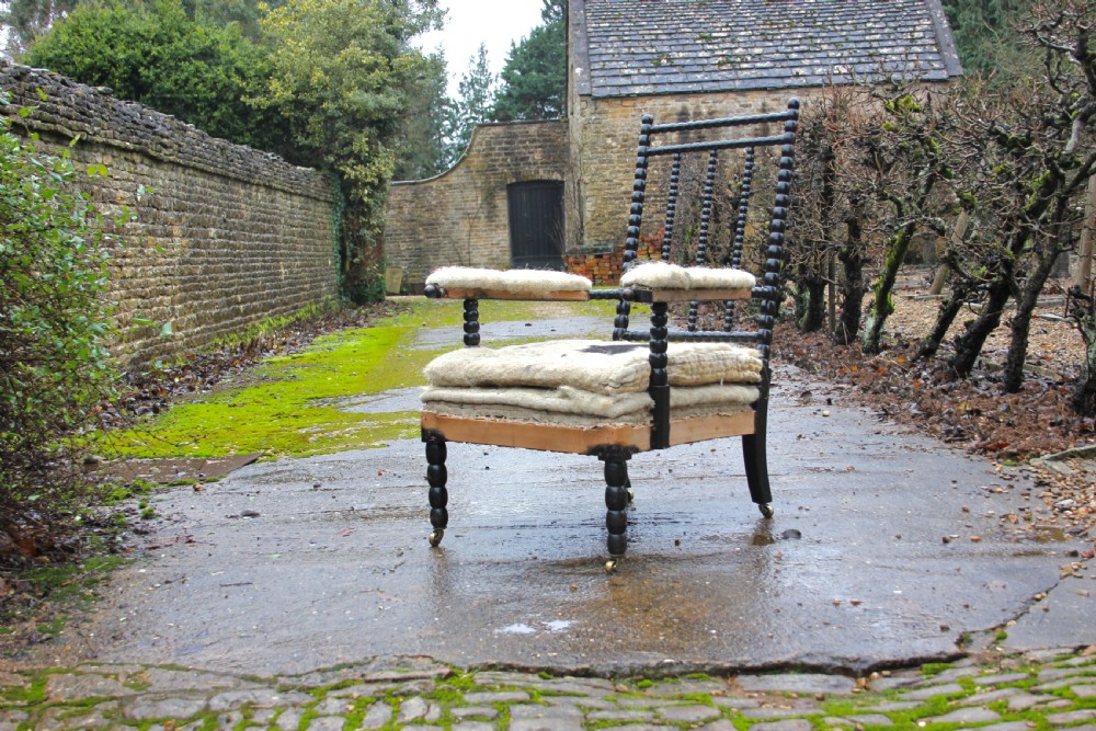 A deep seated bobbin armchair 