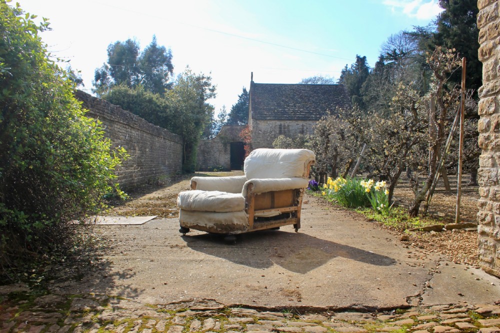A deep seated English armchair 
