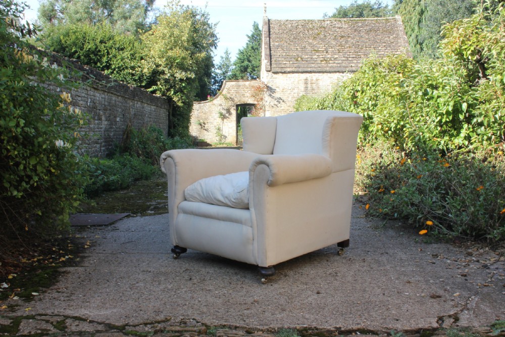 A Victorian deep seated Armchair