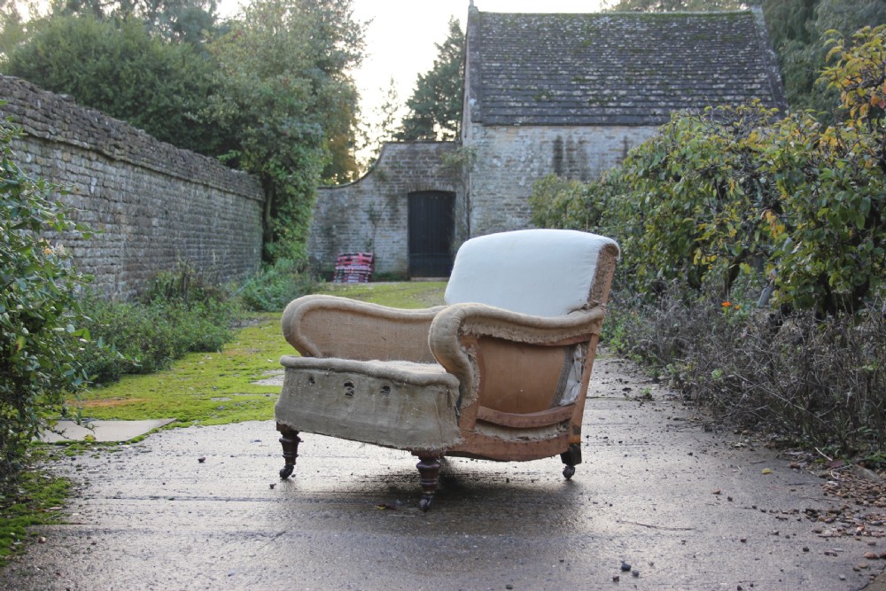 A 19th century scrolled-arm chair