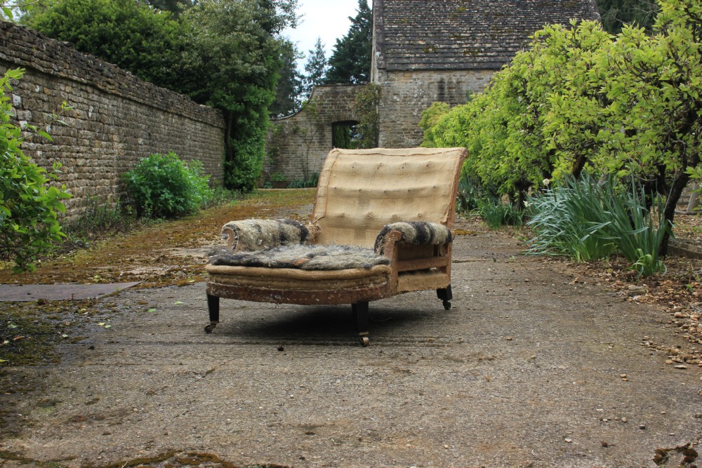 A 19th century deep seated armchair 
