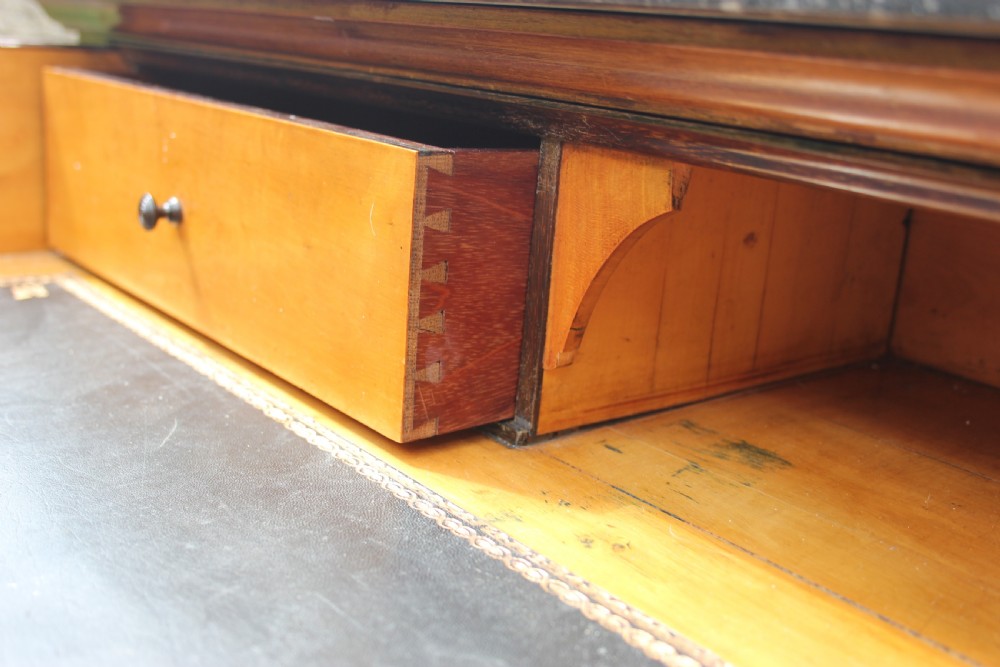 A 19th-century French walnut secretaire featuring a dark marble top, a top drawer, double cupboard doors flanked by spiral twist columns, and scroll feet. View VII