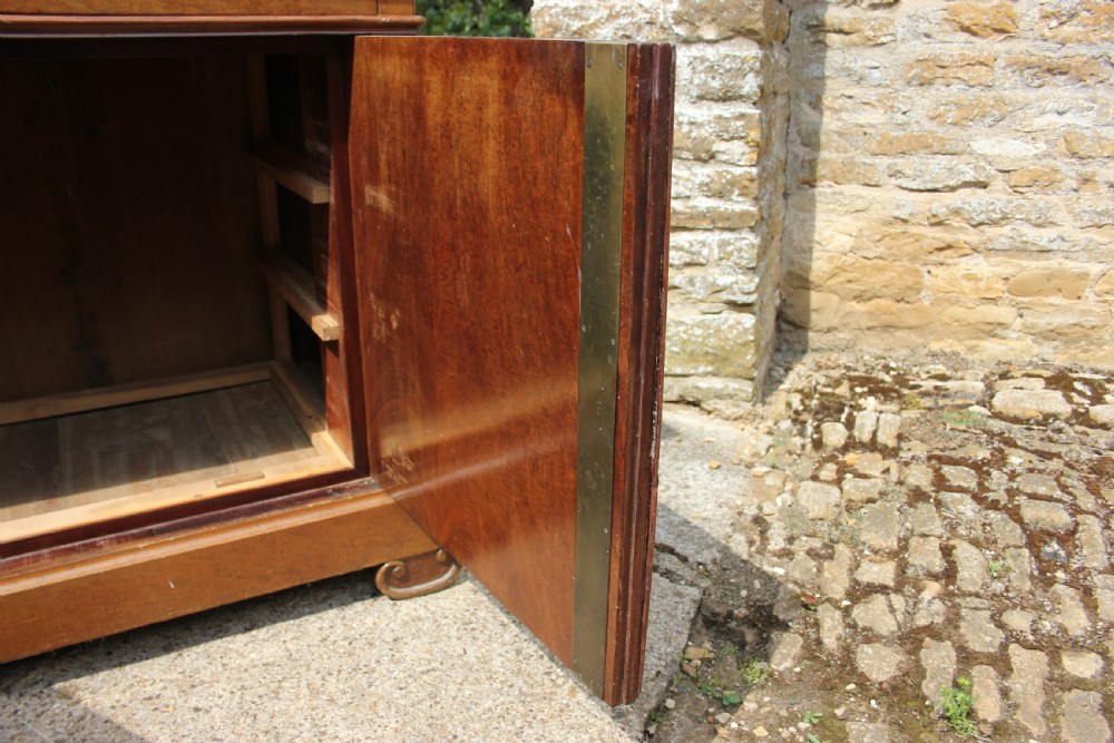 A 19th-century French walnut secretaire featuring a dark marble top, a top drawer, double cupboard doors flanked by spiral twist columns, and scroll feet. View IX